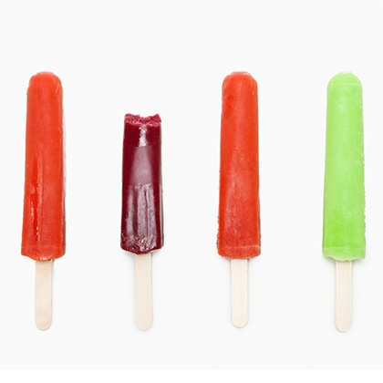 colourful popsicles in a row - one has been bitten shorter