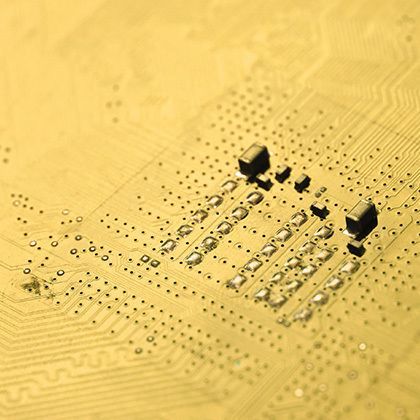 closeup of an golden electronic circuit board 